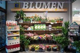 Colorful flowers in a grocery store section.