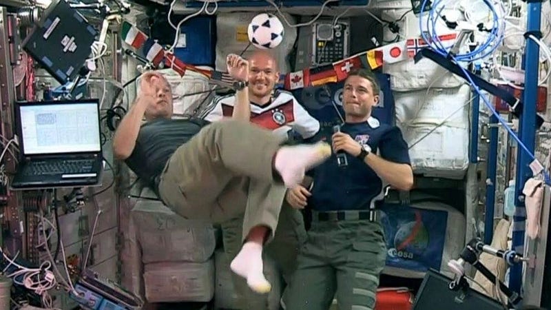 Astronauts playing football in zero gravity