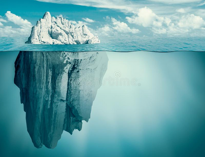 Iceberg floating in water, symbolizing hidden dangers.