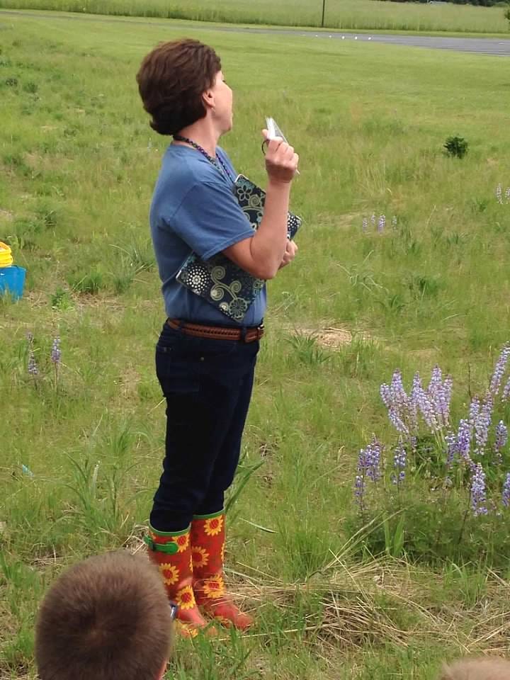 Author sharing knowledge with students about Milkweed