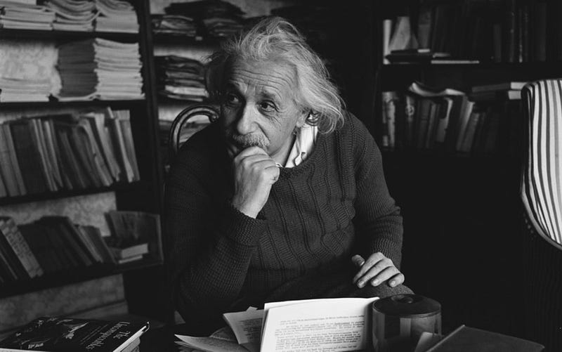 Einstein in his study library, reflecting on knowledge