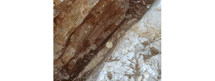 The K-T boundary at Gubbio, illustrating the separation of limestone layers